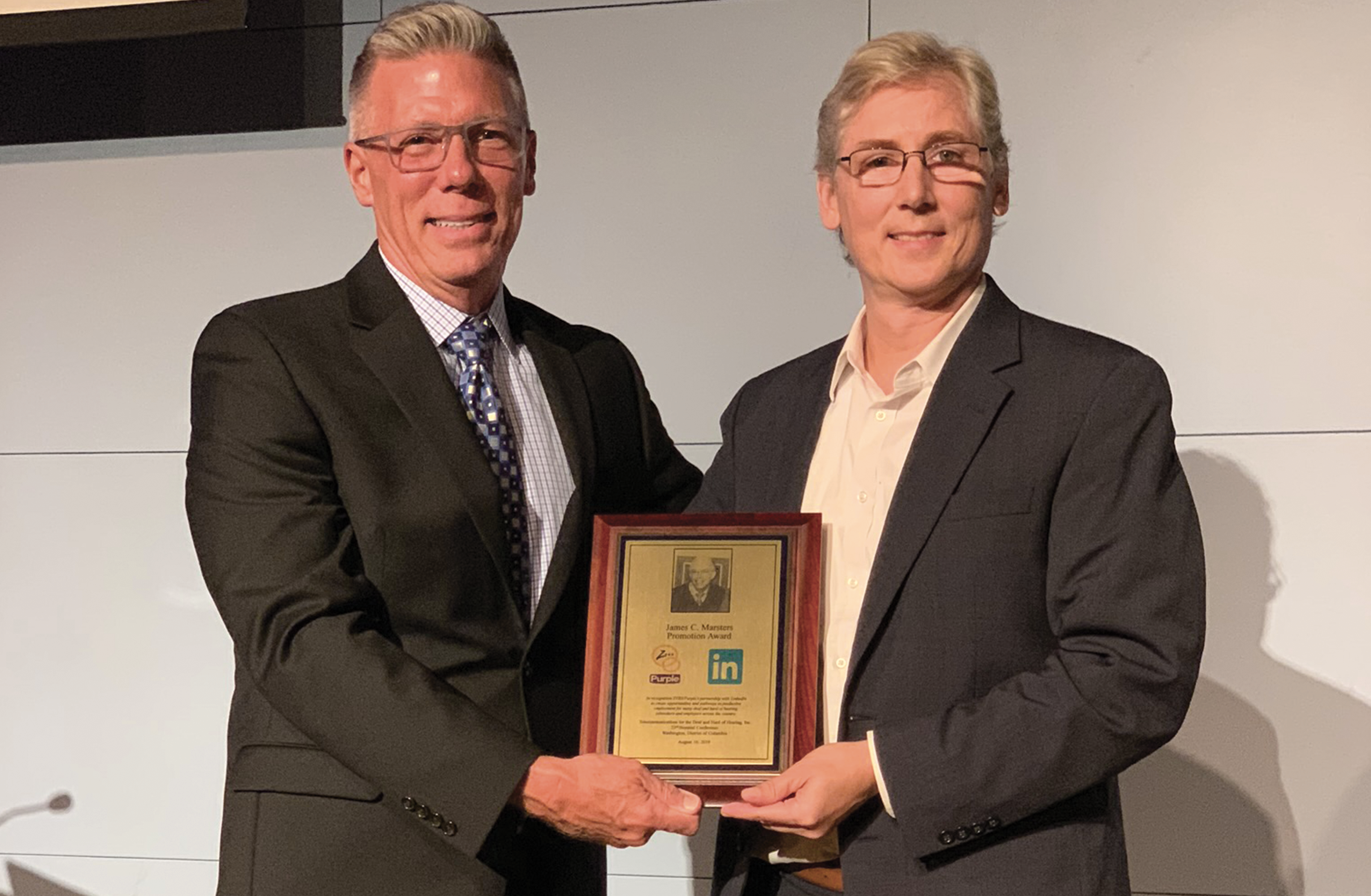 Greg Hlibok Receiving Award from TDI